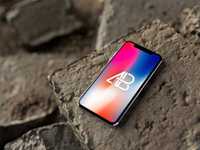 iPhone X on Rocks Mockup by Anthony Boyd Graphics